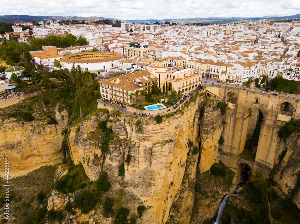 Picturesque landscape with old Spanish town of Ronda dividing in two by deep canyon of El Tajo