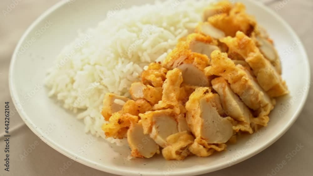 fried chicken topped on rice with spicy dipping sauce fried chicken topped on rice with spicy dipping sauce