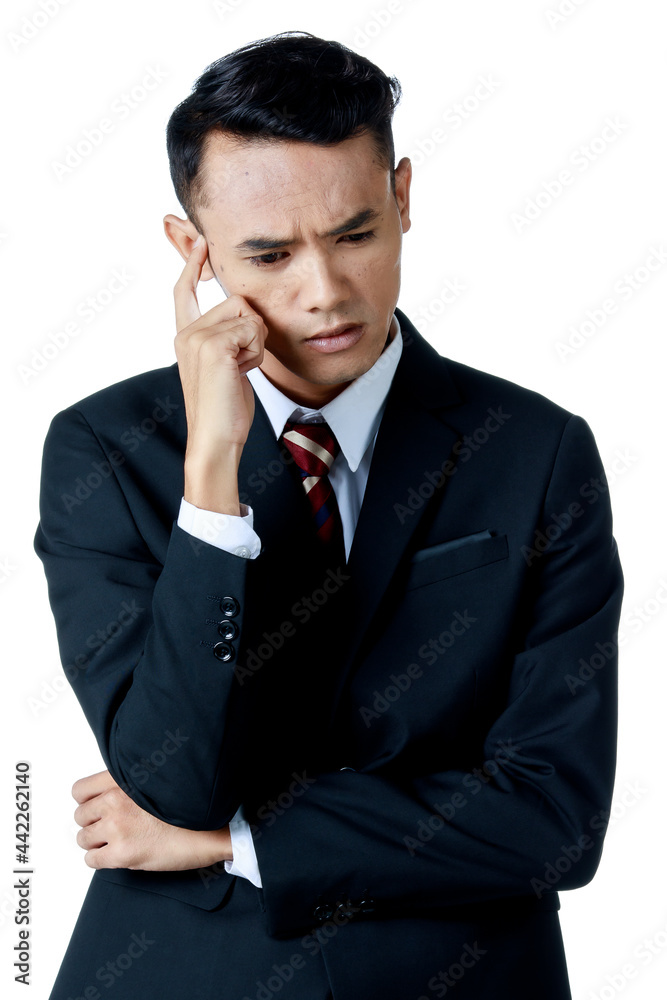Young attractive asian business man wearing black suit with white shirt and necktie do the thinking pose with curious face looking down. White background isolated Young attractive asian business man wearing black suit with white shirt and necktie do the thinking pose with curious face looking down. White background isolated
