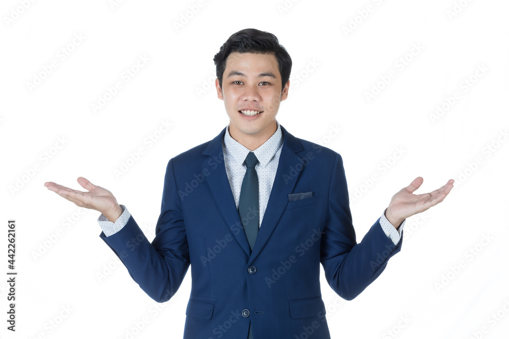 Young attractive asian business man wearing navy blue suit with white shirt and necktie smiling and looking confused by put hands out to the side. White background isolated Young attractive asian business man wearing navy blue suit with white shirt and necktie smiling and looking confused by put hands out to the side. White background isolated