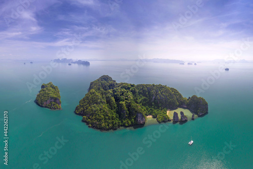 Surrounding Islands of Koh Yao Noi, Thailand islands in the background, three points of the island in a tropical ocean with beaches and copy space for text holiday destination © Huw Penson
