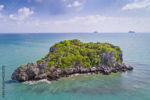 Single Lonely Tropical Island with blue water and green landscape drone aerial uav view of a paradise in Thailand