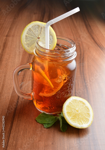 chilled cold lemon fruit ice tea kombucha and mint leaf on wood table cocktail beverage menu