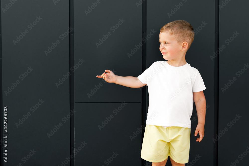 little boy in white t-shirt. space for your logo or design. Mockup for print little boy in white t-shirt. space for your logo or design. Mockup for print