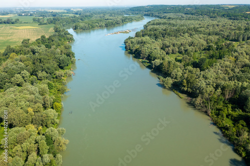 Aerial photo of the natural Drava River in Croatia, surrounded by the forest