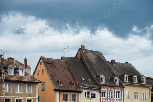 Closeup of medeval architecture on stormy sky background in mulhouse - France photo