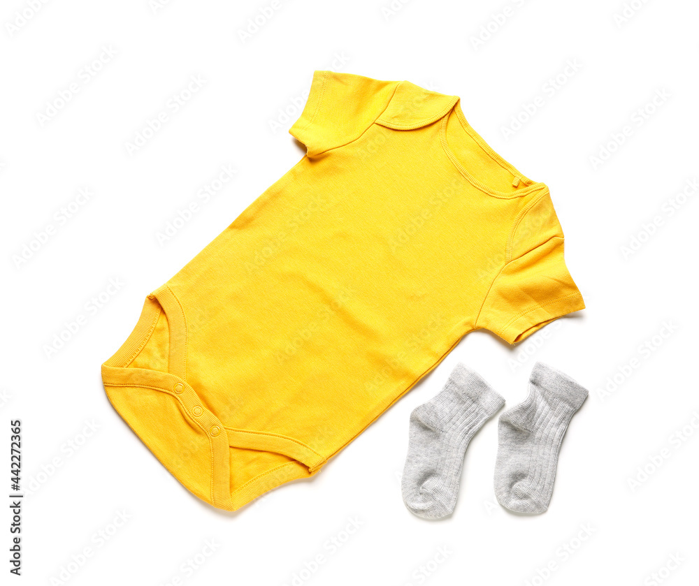 Baby clothes and socks on white background Baby clothes and socks on white background