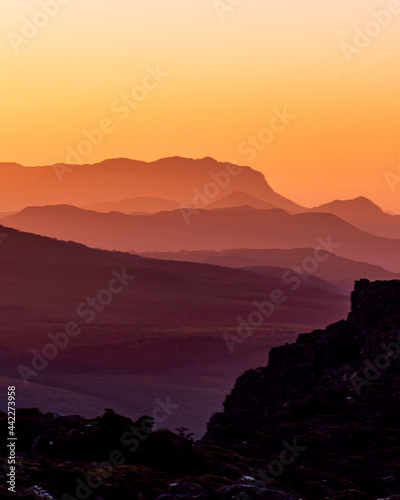 sunset in the mountains, layers of light and colour, Tasmania, Australia.
