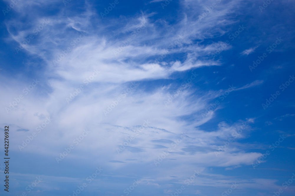 Beautiful white clouds on a blue sky background.