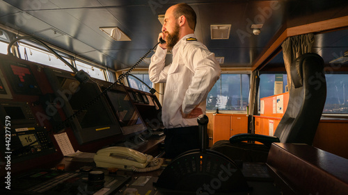 Navigational merchant officer contact with port authority by VHF radio photo