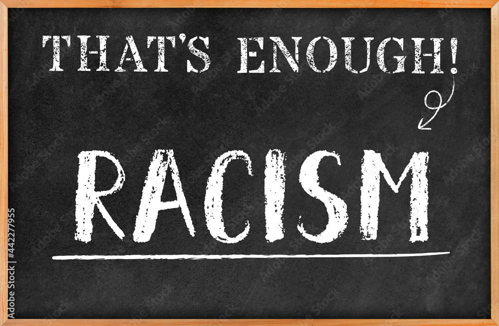 Fototapeta premium THAT'S ENOUGH concept: 3D rendered blackboard with white chalk written RACISM in hand writing letters. Board hanging on white wall. Antithesis and protest. Black lives matter