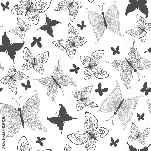 Different butterflies of dark color on a white background.