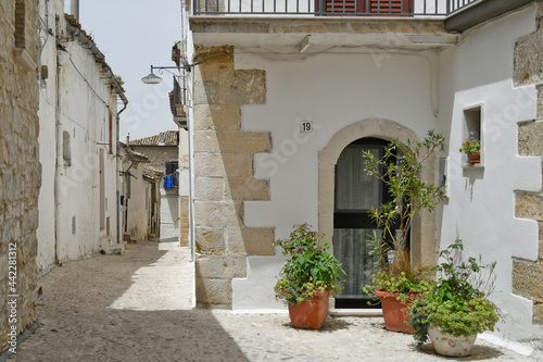Bovino  Italy  06 23 2021. A narrow street among the old houses of a medieval town with a Mediterranean style in the Puglia region.
