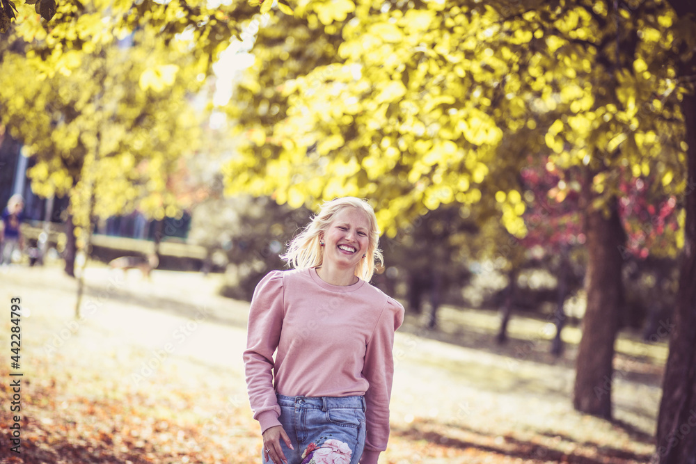 Happy young woman enjoying in the park. Happy young woman enjoying in the park.