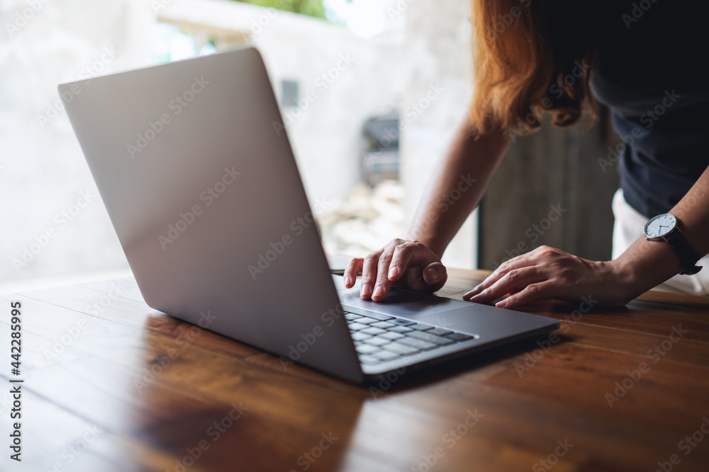 Closeup image of a woman using and working on laptop computer Closeup image of a woman using and working on laptop computer