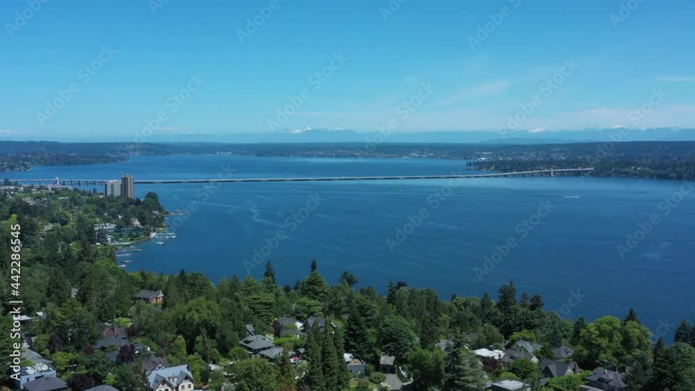 Drone flying over Madison Valley in Seattle wit Lake Washington, North Cascades, 520 Bridge and Kirkland views. Drone flying over Madison Valley in Seattle wit Lake Washington, North Cascades, 520 Bridge and Kirkland views.