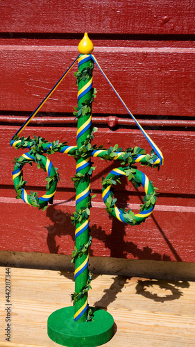 Small replica of a traditional Swedish midsummer's pole (midsommarstång). Tradition and customs concept.