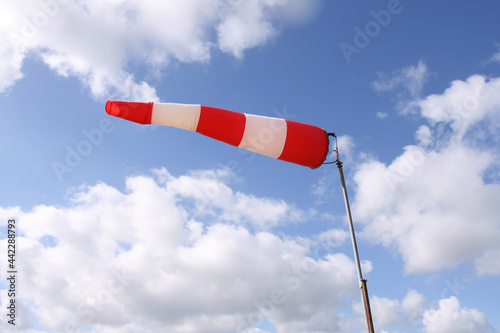 Windsock flag with red and white stripes