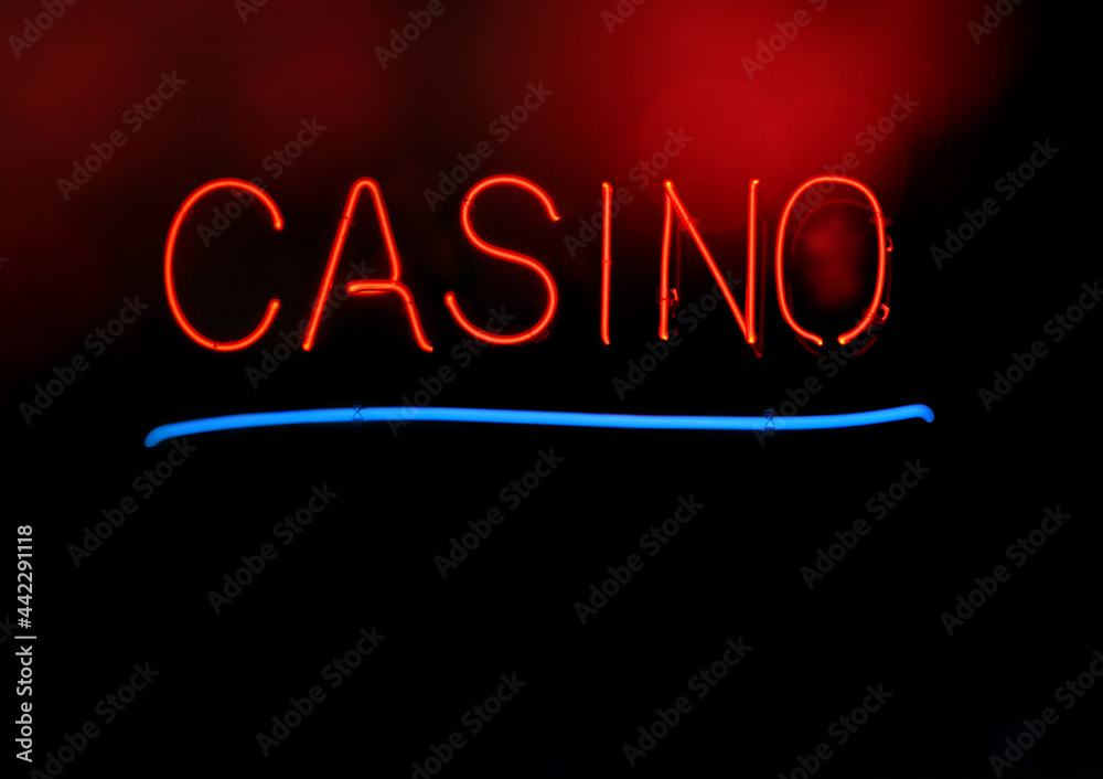 Obraz premium Vintage Red Neon Casino Sign With Red Glowing Bokeh