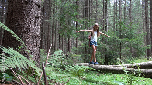 Child in Forest Walking on Tree Log, Kid Playing Hiking in Park, Tourist Adventure Girl in Camping in Mountains, Camp Trip