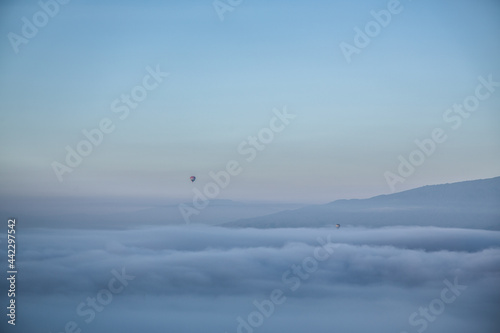 minimal balloon above mountain and cloud
