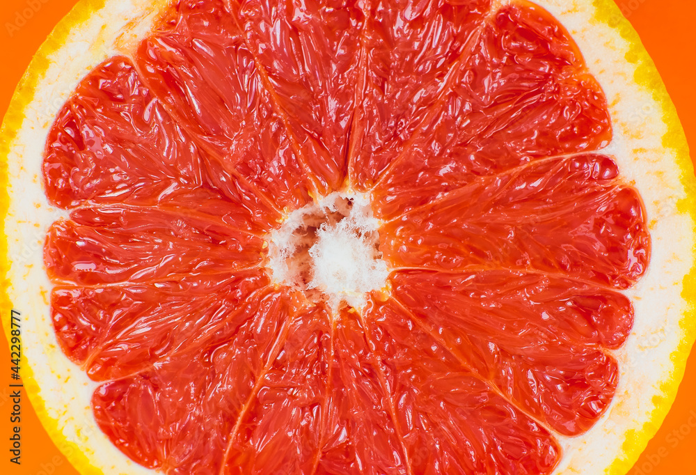 Grapefruit texture inside on the orange background. Citrus close up photo. Healthy food. Awesome wallpaper. Vegetarian and vegan concept. Vitamins from nature. Minimalism, original beautiful photo. Grapefruit texture inside on the orange background. Citrus close up photo. Healthy food. Awesome wallpaper. Vegetarian and vegan concept. Vitamins from nature. Minimalism, original beautiful photo.