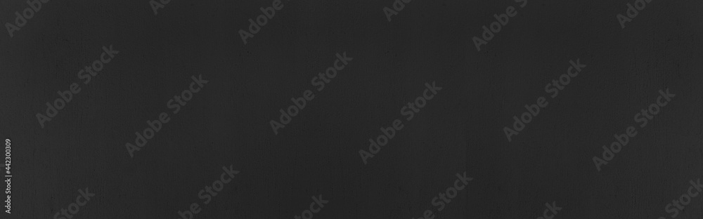 Panorama of Close up retro plain dark black cement & concrete wall background texture for show or advertise or promote product and content on display