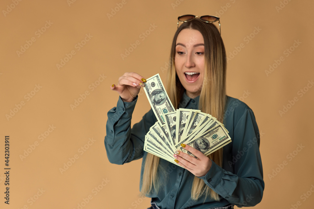 woman holds cash money in dollar banknotes woman holds cash money in dollar banknotes
