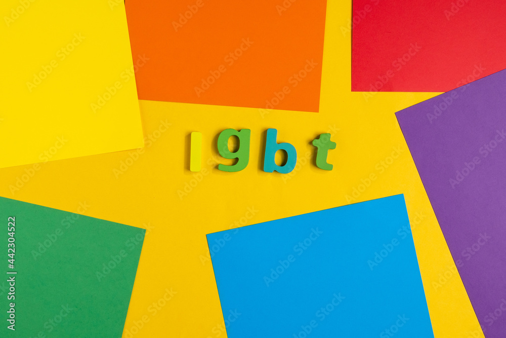 Lettering LGBT. on a rainbow background. Top view Lettering LGBT. on a rainbow background. Top view