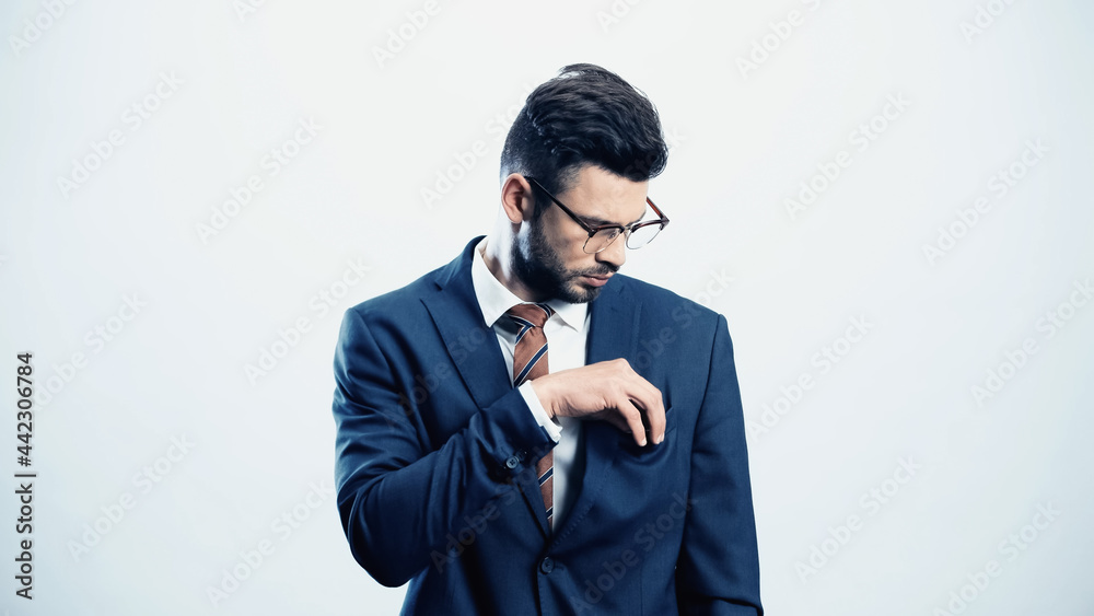 businessman looking in pocket of blazer isolated on white businessman looking in pocket of blazer isolated on white