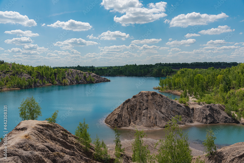 Landscape with blue lake and white clouds Landscape with blue lake and white clouds