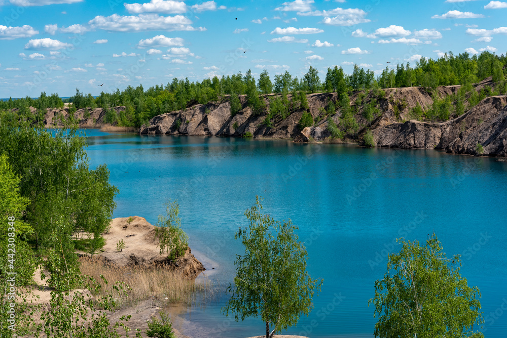 Obraz premium Landscape with blue lake and white clouds