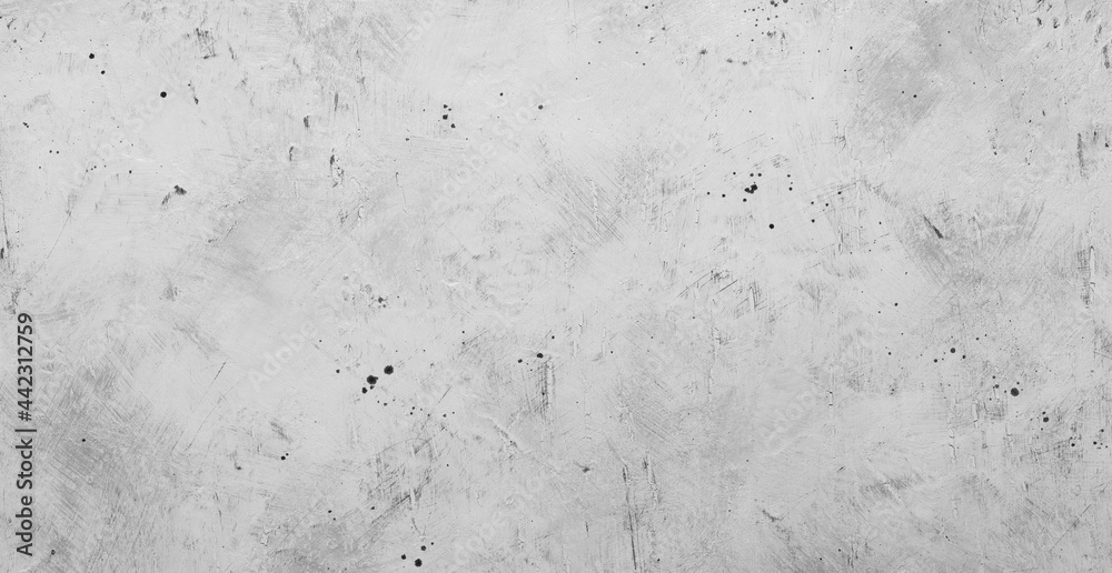 Gray backdrop with blur effect, picture of gray concrete wall with black dots on surface.