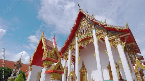 Beautiful for Wat Chalong temple for tourists like to come to worship in Phuket is a historical landmark of Thailand,wide angle view for Video 4K. photo