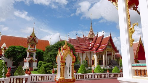 Many locals Wat Chalong temple for tourists like to come to worship in Phuket is a historical landmark of Thailand,wide angle view for Video 4K. photo