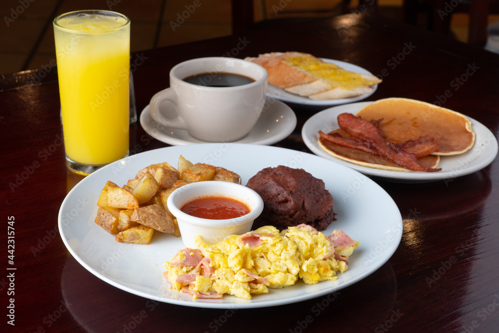 breakfast with beans, potato, tomato sauce and scrambled eggs
breakfast with beans, potato, tomato sauce and scrambled eggs