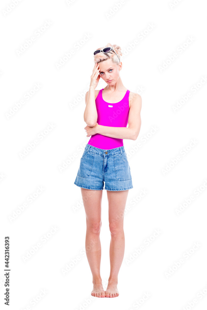 Vertical full length studio portrait of young Caucasian woman wearing summer outfit having stress headache, white background Vertical full length studio portrait of young Caucasian woman wearing summer outfit having stress headache, white background