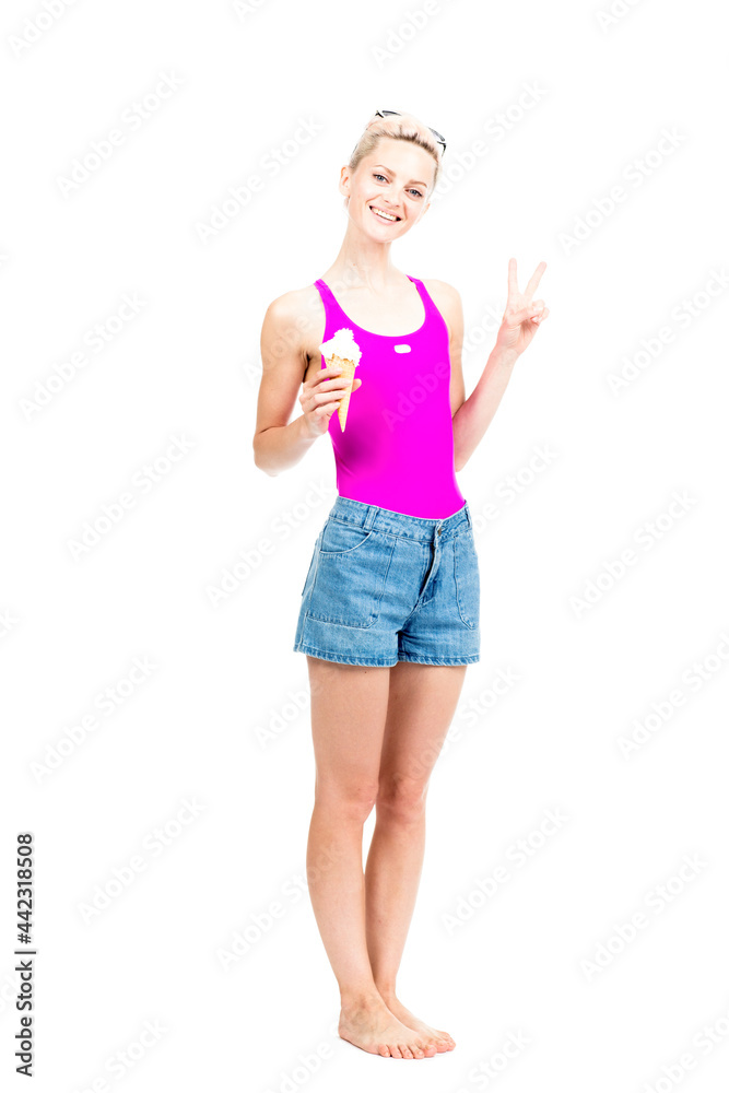 Vertical full length studio portrait of modern young woman wearing summer outfit posing on camera with ice cream, white background Vertical full length studio portrait of modern young woman wearing summer outfit posing on camera with ice cream, white background