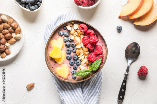 Wallpaper Mural Banana and blueberry smoothie for healthy breakfast in coconut bowl isolated on white background. Without sugar. Top view. Torontodigital.ca