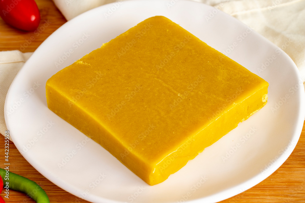 Almond halva. Halva on wooden background. Turkish halvah for Breakfast. Local name badem helvası