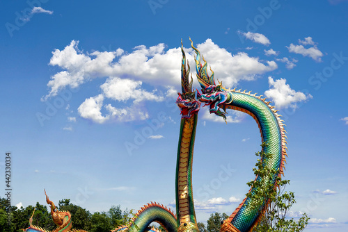 Udon Thani, Thailand - 21 June 2021 : Twin Stucco painted as a large serpent at Pra kai keaw wang nakin, Located at Ban Don swan, Phen District, Udon Thani, Thailand. photo