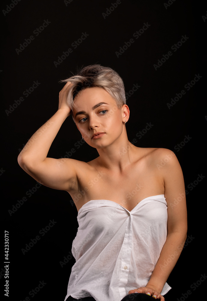 fashion beautiful young woman with short hair.strong blonde girl.