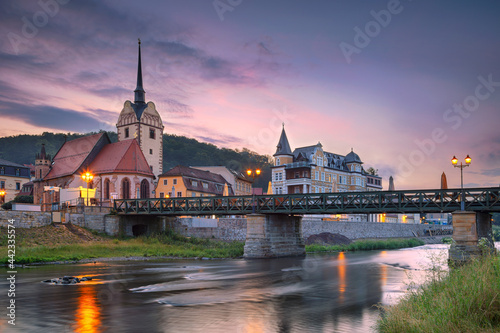 Gera, Germany. Cityscape image of old town Gera, Thuringia, Germany with St. Mary's Church and Untermhaus Bridge over White Elster River at sunset. photo