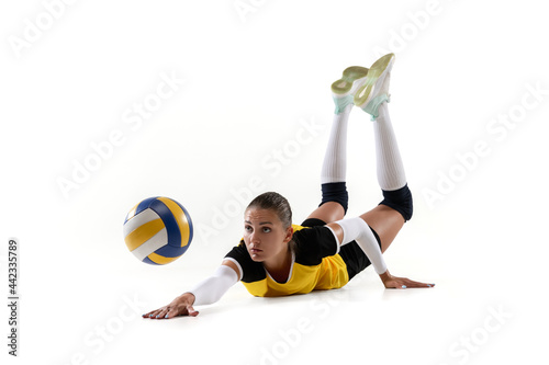 Fototapeta Naklejka Na Ścianę i Meble -  Female professional volleyball player with ball isolated on white studio background. The athlete, exercise, action, sport, healthy lifestyle, training, fitness concept.