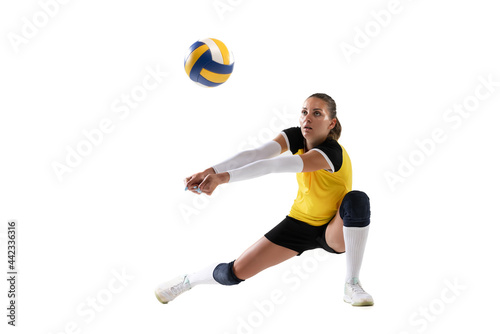 Canvas Print Female professional volleyball player with ball isolated on white studio background
