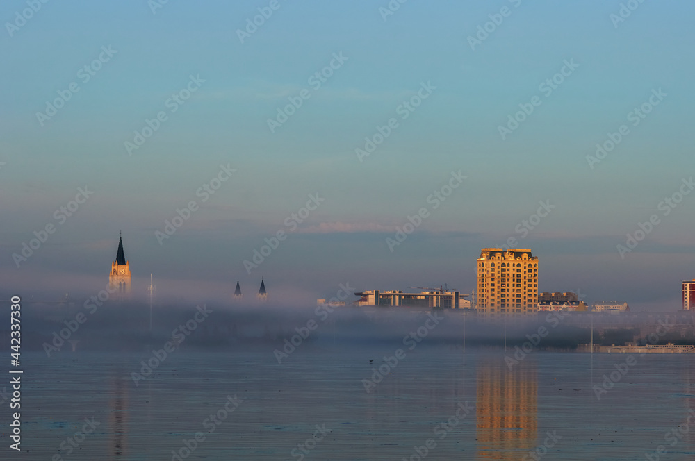 Morning fog over the river during flooding. Morning fog over the river during flooding.