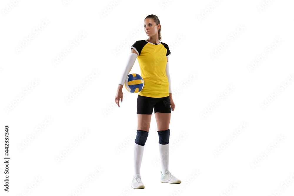 Young female volleyball player isolated on white studio background. Woman in sport's equipment and shoes or sneakers training and practicing. Young female volleyball player isolated on white studio background. Woman in sport's equipment and shoes or sneakers training and practicing.