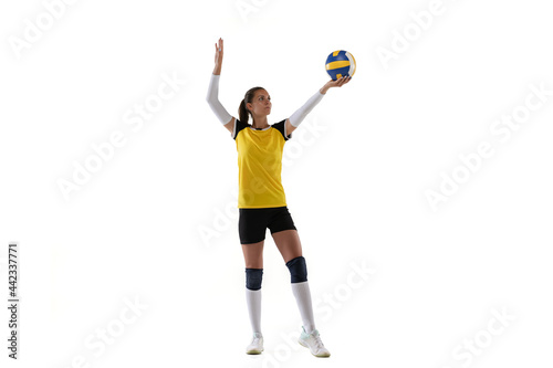 Female professional volleyball player with ball isolated on white studio background. The athlete, exercise, action, sport, healthy lifestyle, training, fitness concept. © master1305