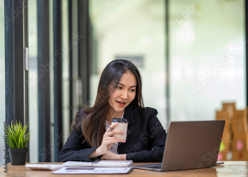 accountant woman happy working in new office, business woman working through laptop