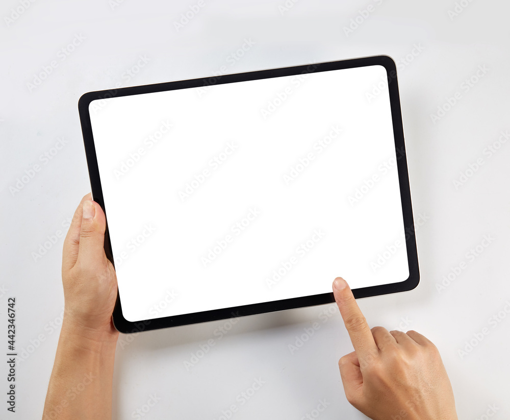 Hand holding a mockup tablet with blank screen isolated on white Hand holding a mockup tablet with blank screen isolated on white